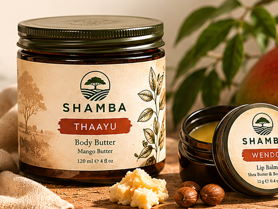 THAAYU body butter jar and WENDO lip balm tin styled with mango, shea butter, and leaves